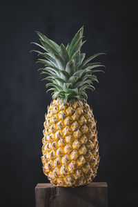 Close-up of fruits against black background