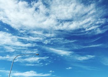 Low angle view of bird flying against sky