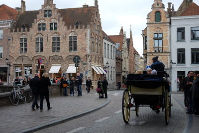 People walking on street in city