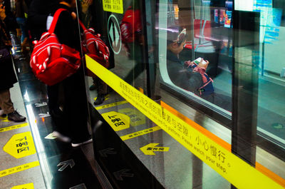 Reflection of man on glass window