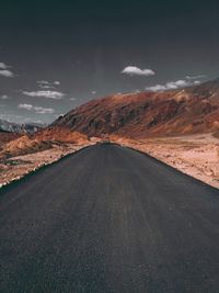 Road amidst landscape against sky