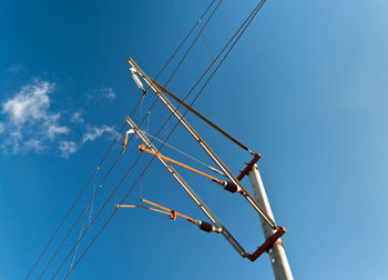 Low angle view of electricity pylon against sky