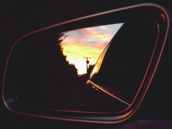 Car on road at sunset