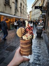 Close-up of hand holding ice cream