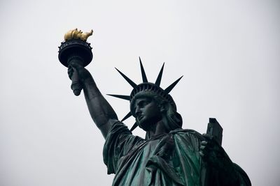  statue of liberty against sky