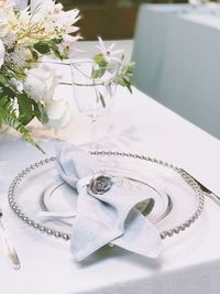 High angle view of white flower bouquet on table