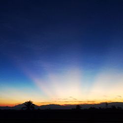 Scenic view of silhouette landscape against clear sky at sunset