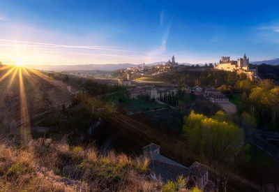 Panoramic view of buildings against sky during sunset