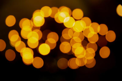 Defocused image of illuminated lights at night