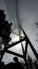 Low angle view of ferris wheel against sky