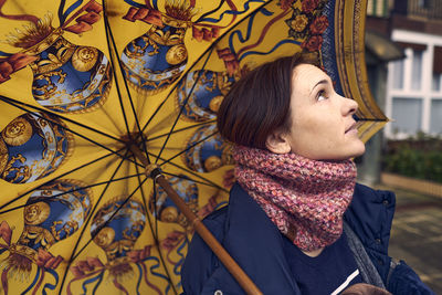 Portrait of young woman looking away