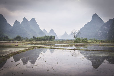 View of lake with mountain range in background