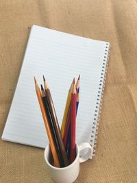 High angle view of colored pencils on table