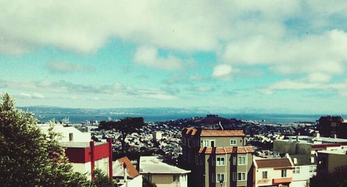 High angle view of town against cloudy sky