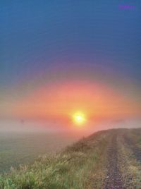 Scenic view of landscape at sunset