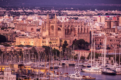 Sailboats in city at waterfront