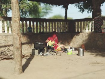 People on table by railroad track