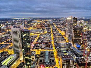 High angle view of illuminated cityscape against sky