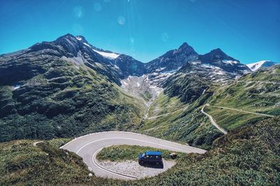 High angle view of van by road on mountain against sky