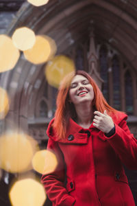 Close up happy lady and bokeh lights on street portrait picture