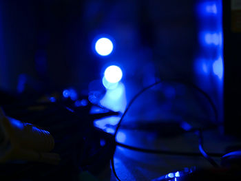 Close-up of illuminated lighting equipment at night