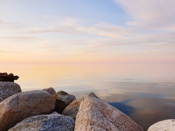 Scenic view of sea against sky at sunset