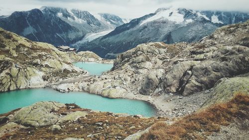 Scenic view of lake and snowcapped mountains