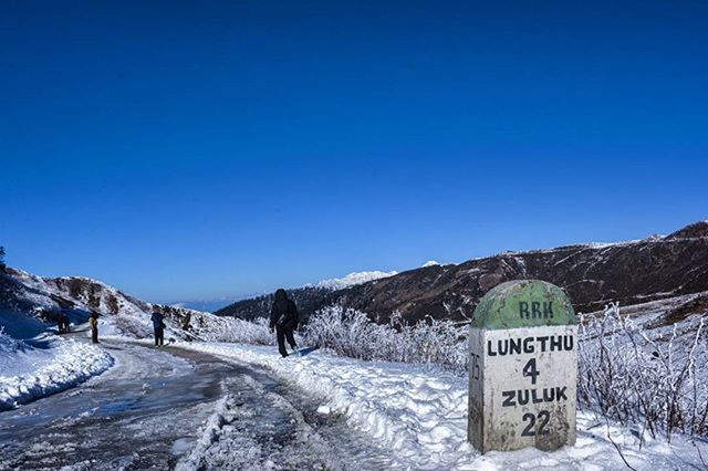 snow, winter, cold temperature, clear sky, copy space, blue, landscape, season, mountain, tranquil scene, tranquility, nature, text, communication, scenics, white color, beauty in nature, western script, covering, weather