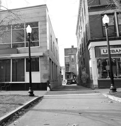 Street amidst buildings in city against sky