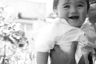 Close-up of cute baby boy looking away