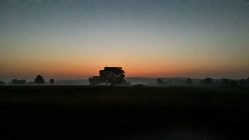 Scenic view of silhouette landscape against sky during sunset