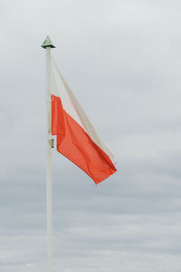 Low angle view of flag against sky