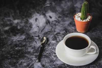 High angle view of coffee cup on table