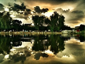 Scenic view of lake against cloudy sky