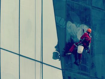 Man working on rope against building