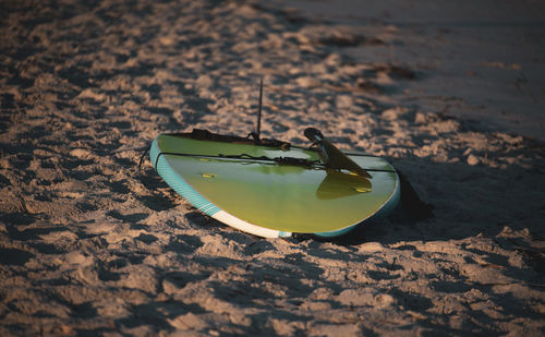 High angle view of sunglasses on beach