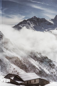 Scenic view of snowcapped mountains against sky