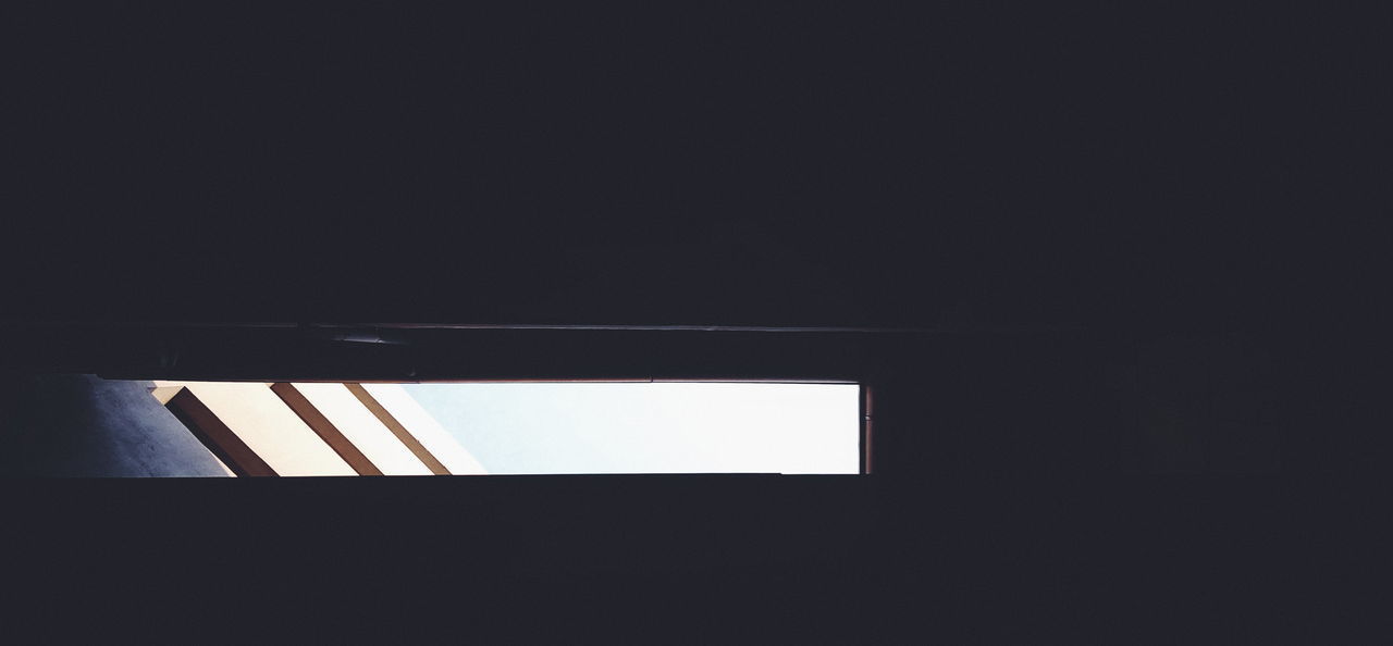 LOW ANGLE VIEW OF SILHOUETTE BUILDING AGAINST SKY