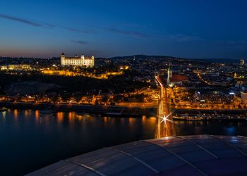 Illuminated buildings in city at night