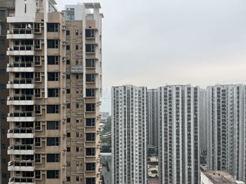 Low angle view of modern buildings against sky