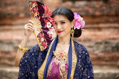 Portrait of smiling woman in traditional clothing