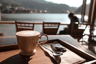 Close-up of coffee served on table at cafe