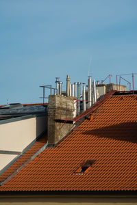 Roof of building against clear blue sky