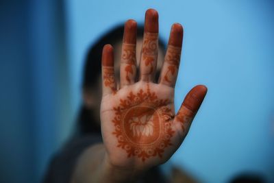 Close-up of woman with henna tattoo