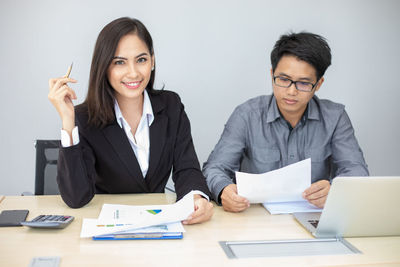 Colleagues working at office