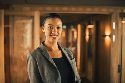 Portrait of smiling female professional at legal office