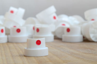 Close-up of spray bottle caps on table