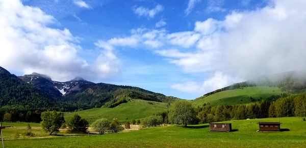 Scenic view of landscape and mountains against sky