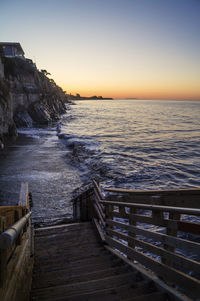 Scenic view of sea against clear sky during sunset