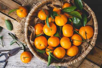 High angle view of fruits in basket on table